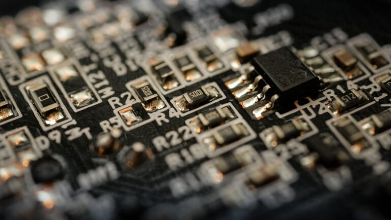 Detailed close-up of a microchip on an electronic circuit board, representing AI stocks and semiconductor market performance