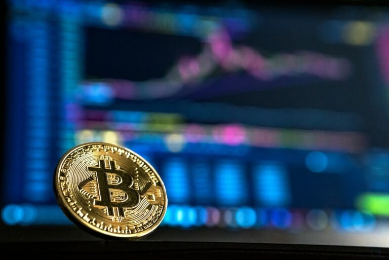 Gold-colored bitcoin coin representing direct bitcoin ownership versus a bitcoin ETF