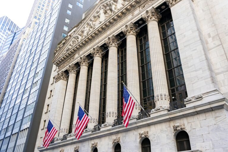 New York Stock Exchange building with American flags